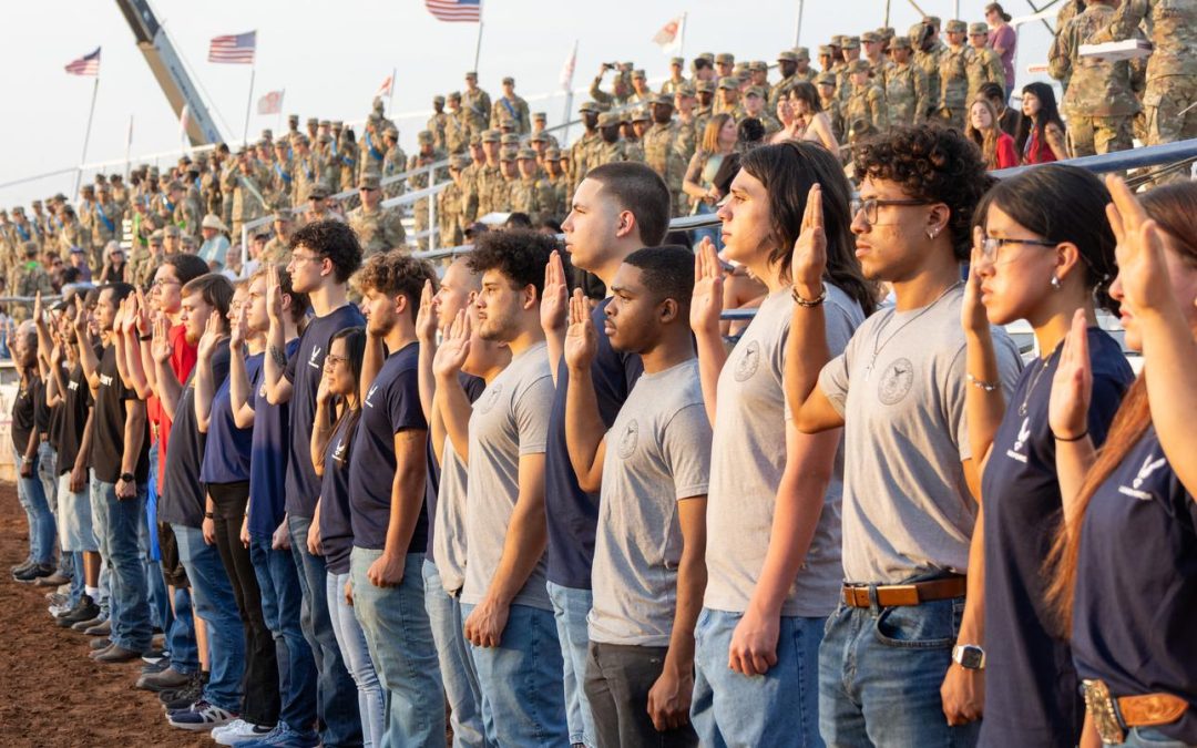 Saddle up: Military enlistees take the oath at the rodeo